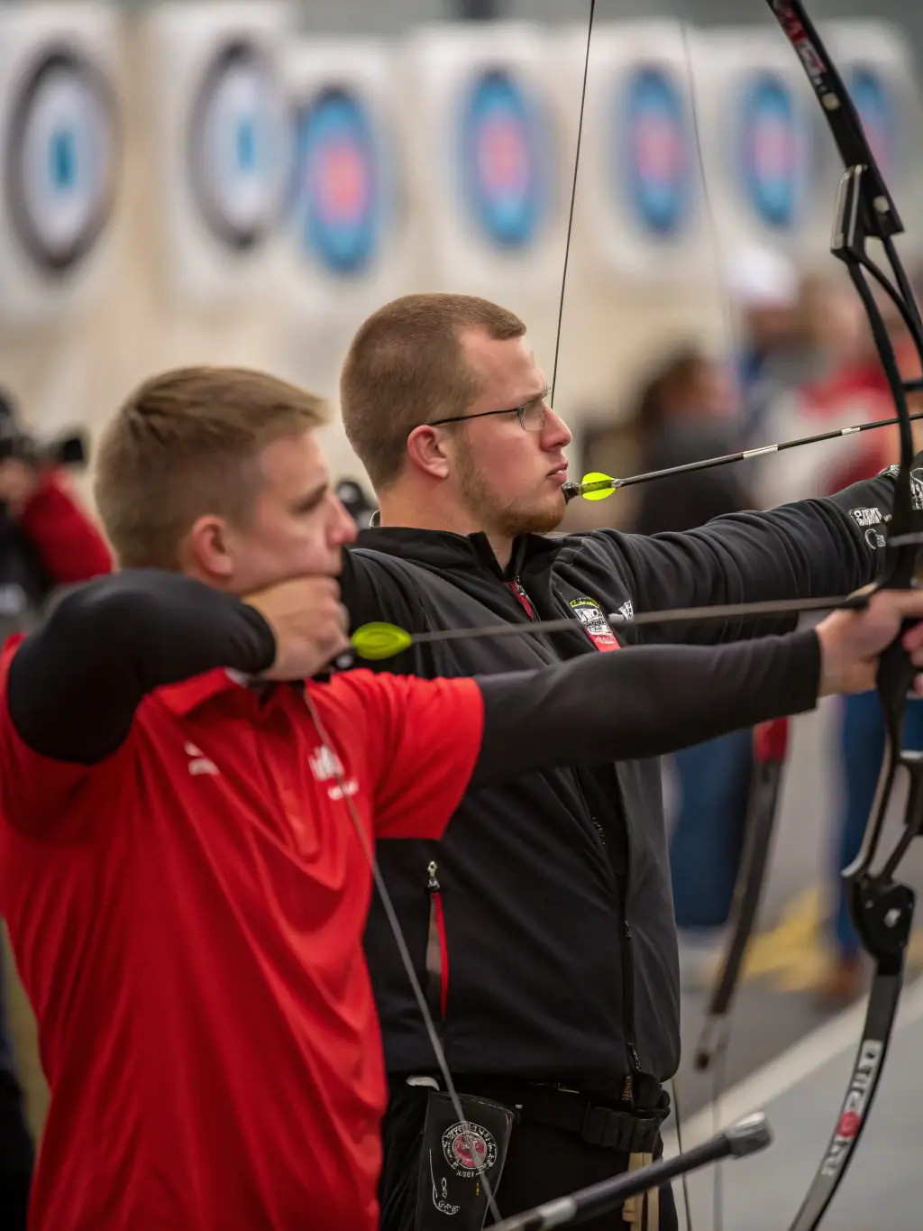 Archers participating in a local archery competition organized by CLUB DES ARCHERS TULLISTES, showcasing their skills and sportsmanship.